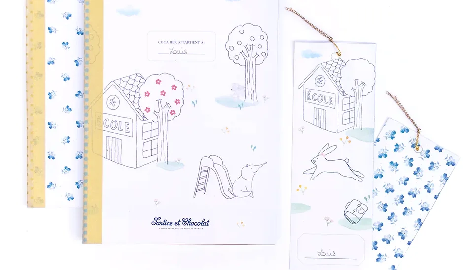 Cahier et marque-pages de rentrée illustrés d'une école et d'un lapin